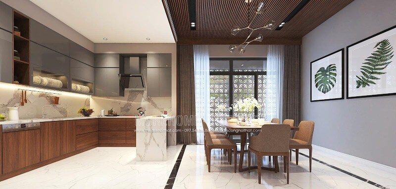 Thiết kế nội thất phòng bếp liền phòng ăn sang trọng, độc đáo với nội thất gỗ chủ đạo từ tủ bếp, bộ bàn ghế, tường ốp gỗ tại biệt thự, nhà phố Vinh, Nghệ An.